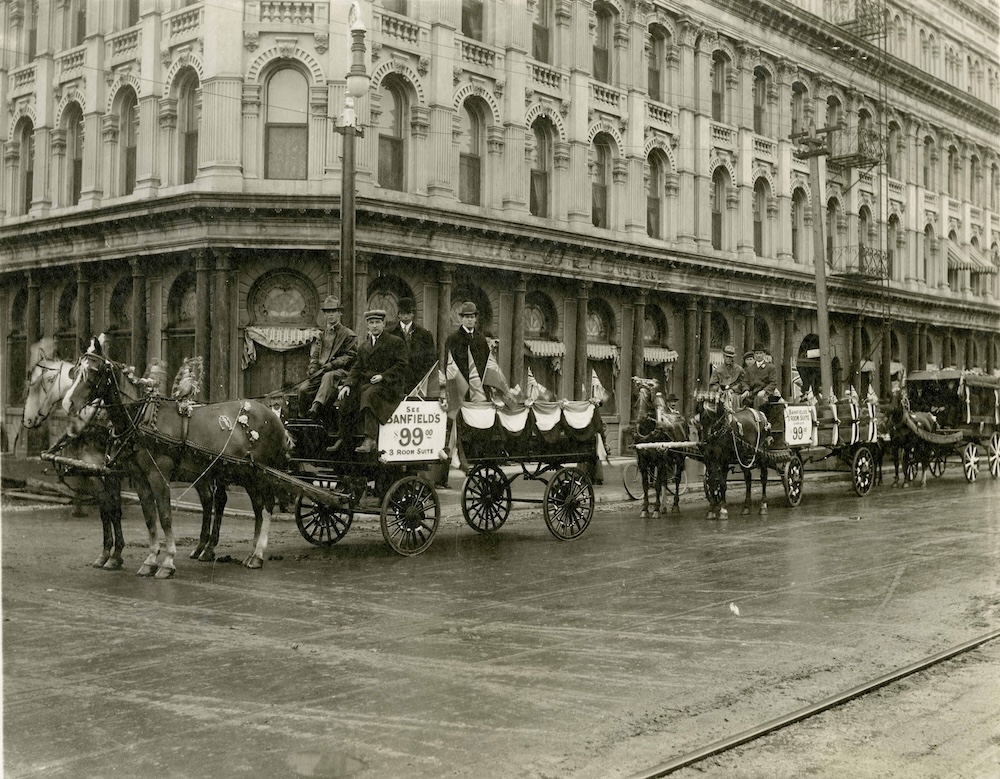 1912 - Banfiend’s Furniture carts in front of Empire Hotel in Winnipeg