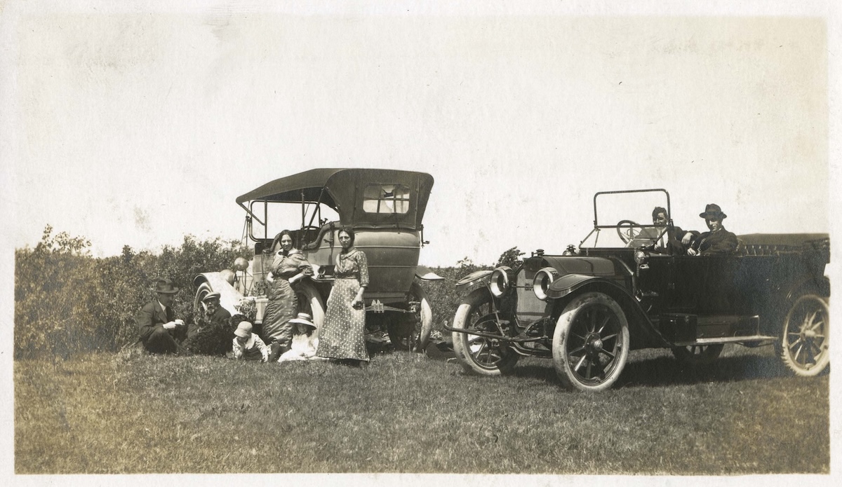 1913-1915ca-People posing next to cars in field