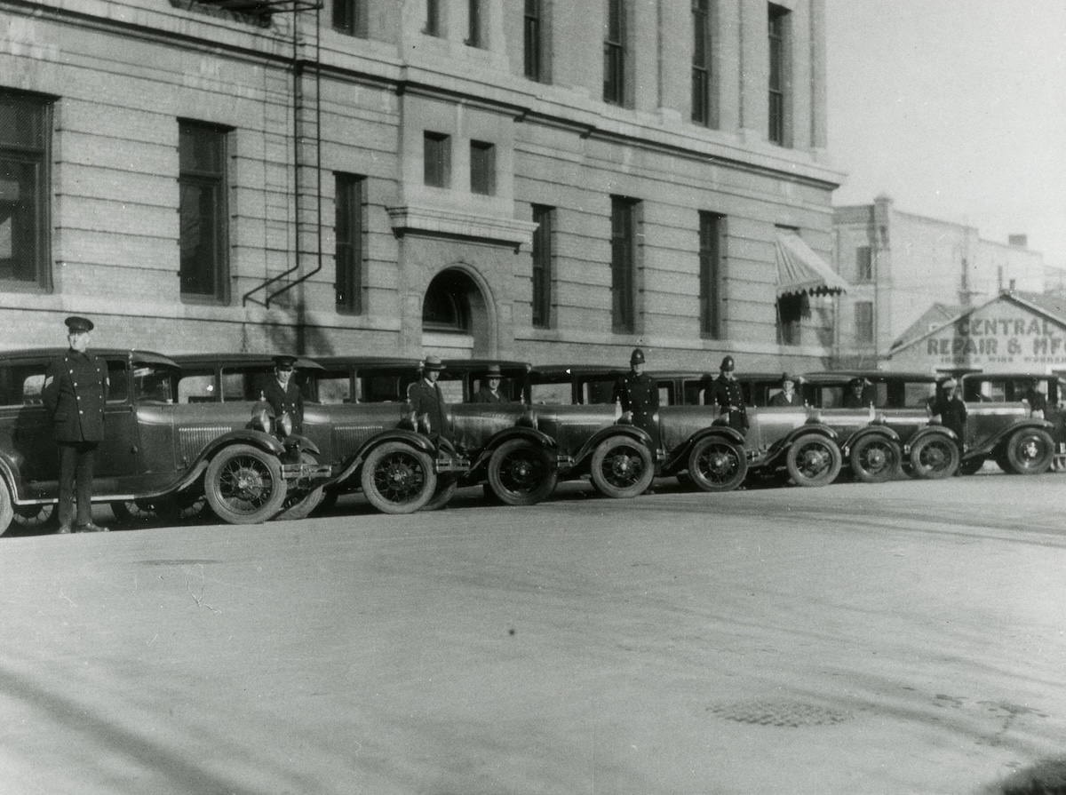 1930ca - Police cars outside Rupert Avenue Police Station