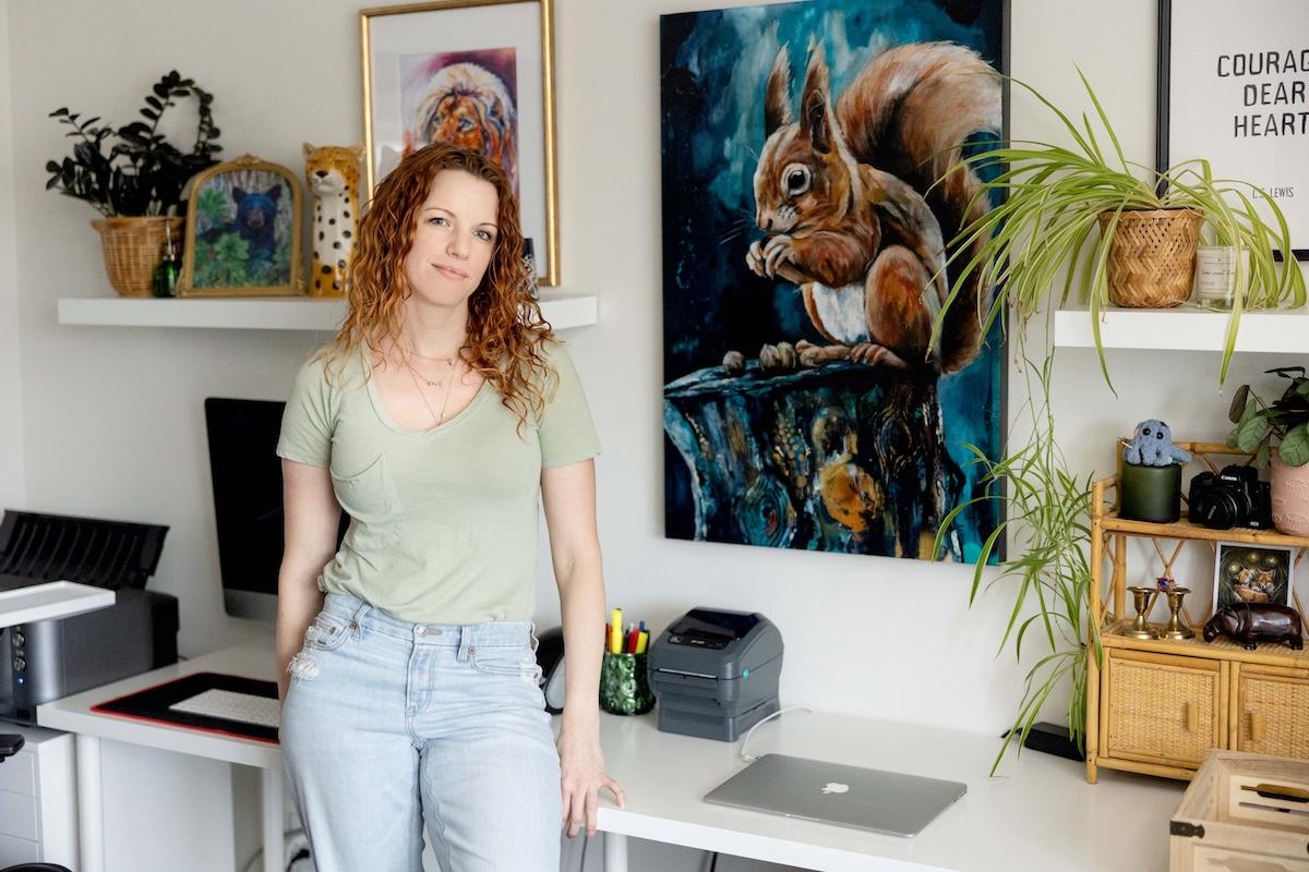Wildlife Artist Lisa Whitehouse Posing with my squirrel in my home studio