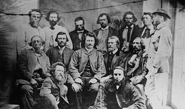 Councillors of the Provisional Government of the Métis Nation. Front row, L-R: Robert O'Lone, Paul Proulx. Centre row, L-R: Pierre Poitras, John Bruce, Louis Riel, John O'Donoghue, François Dauphinais. Back row, L-R: Bonnet Tromage, Pierre de Lorme, Thomas Bunn, Xavier Page, Baptiste Beauchemin, Baptiste Tournond, Joseph (Thomas?) Spence[1] This image is frequently listed with the caption that the persons in the photograph are councillors of the Provisional Government of the Métis Nation, however, there are several persons in the image who were not councillors in the Legislative Assembly, but did hold offices at different levels of the provisional government.
