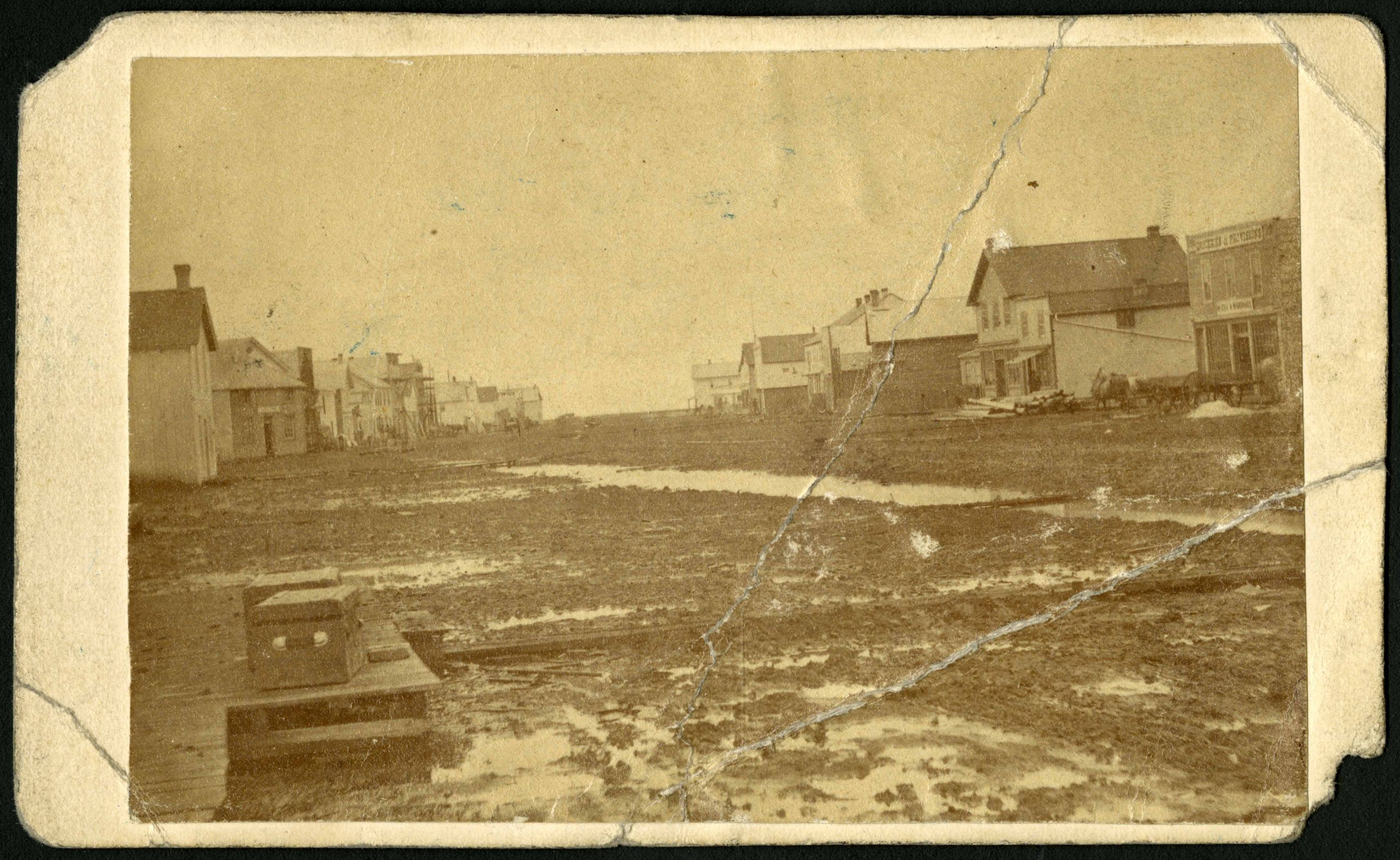 1872-Photograph of a muddy Main Street in 1872, facing north from Portage Avenue