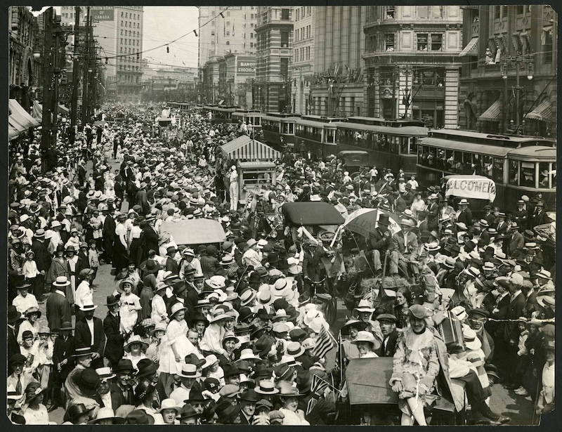 1919-July 19-Photograph shows thousands of people and a long line of streetcars on Main St. looking North near Portage intersection
