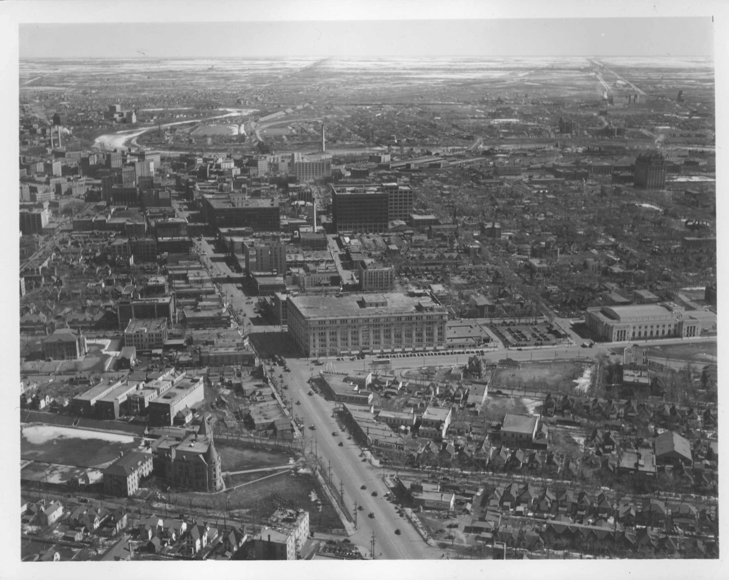 1935-Aerial view of Winnipeg looking east on Portage Avenue towards Main Street probably from over Langside Street