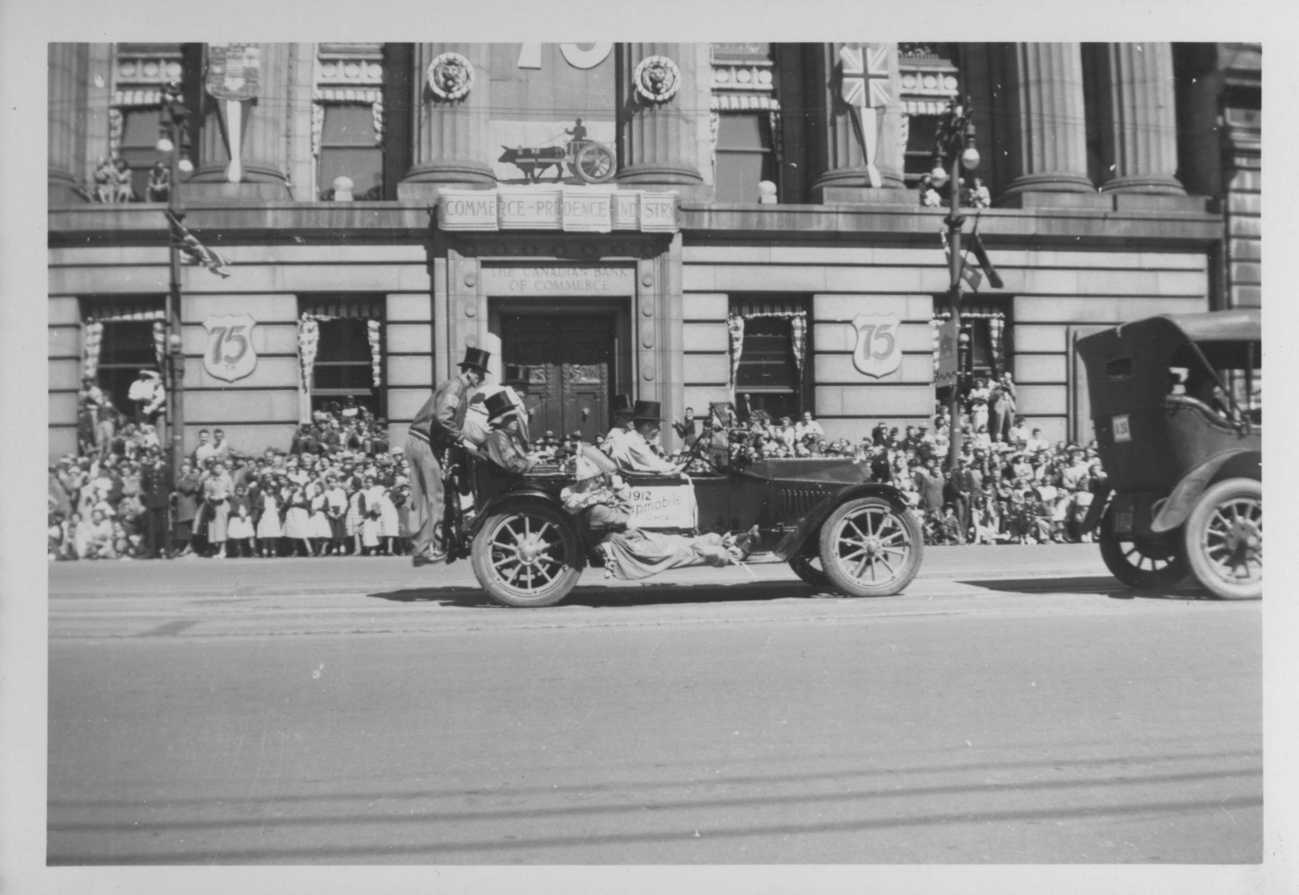 1949-Automobile, clowns, Winnipeg's 75th Anniversary Parade